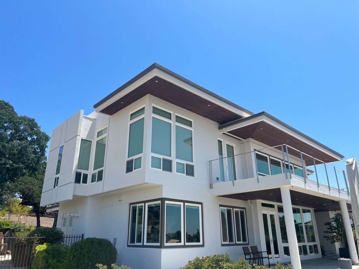 Modern two story home with crisp white exterior painted by Richards Painting